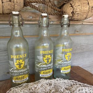 Drie flessen van Phénix Limonade